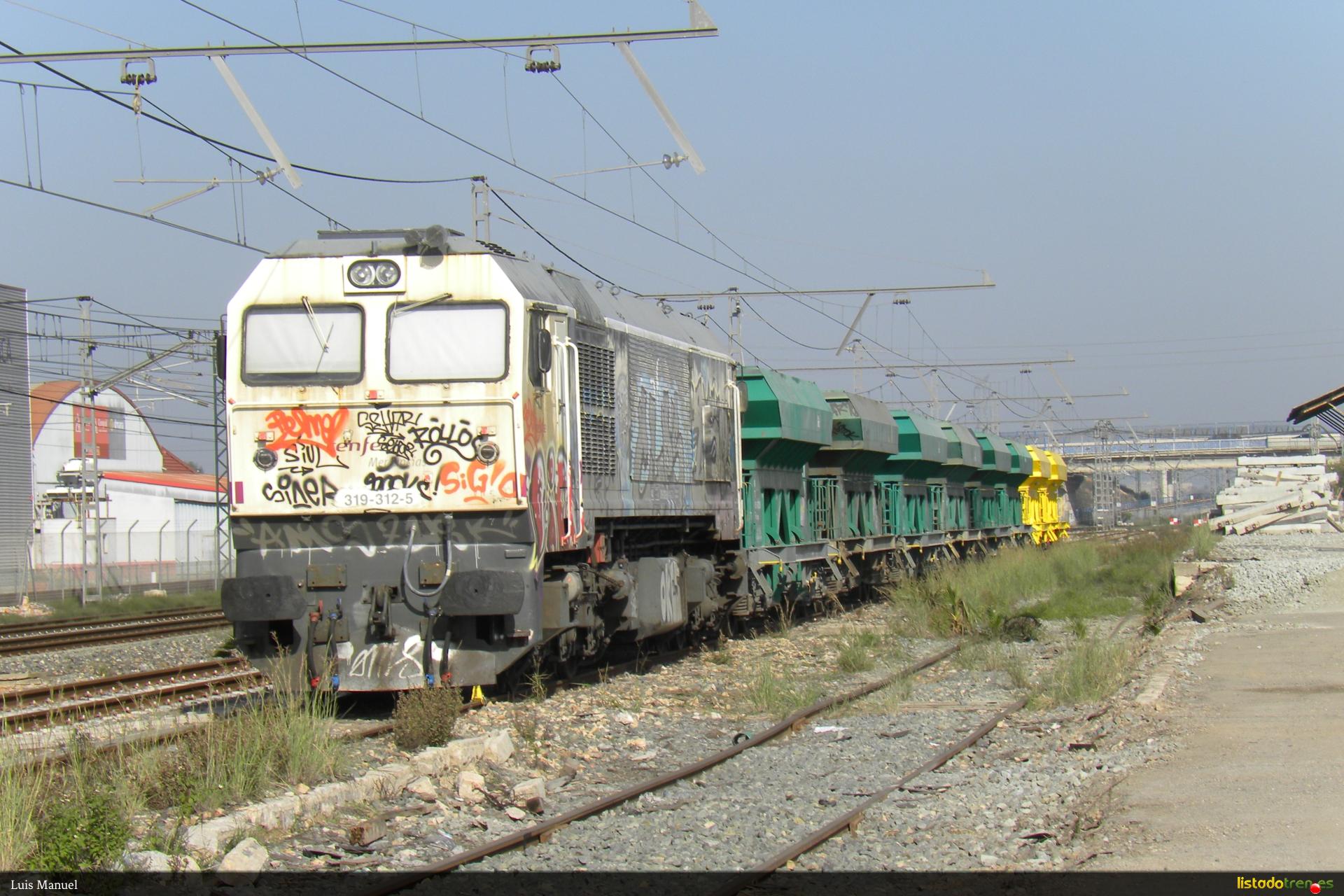 319.312-5 con tolvas de renfe y ferrovial apartada